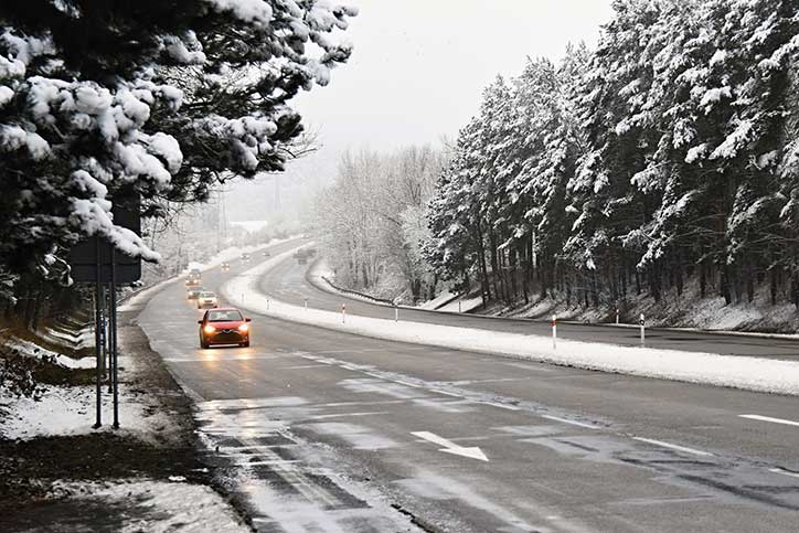 car driving in winter road conditions