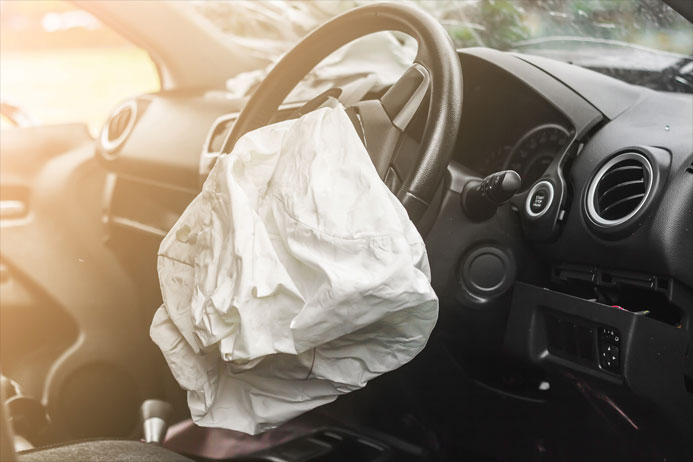 Interior of car after accident with deployed airbag