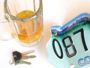Drunk driving concept, beer mug, keys, license plate