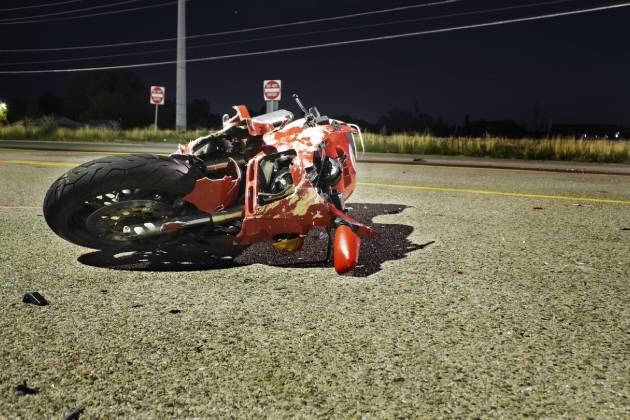 Motorcycle in road after accident