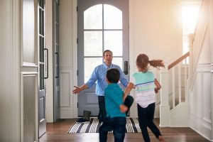 son and daughter running into their dad’s arms