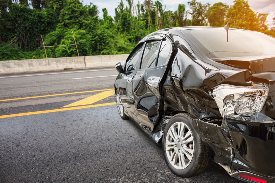 car damaged after accident on the highway