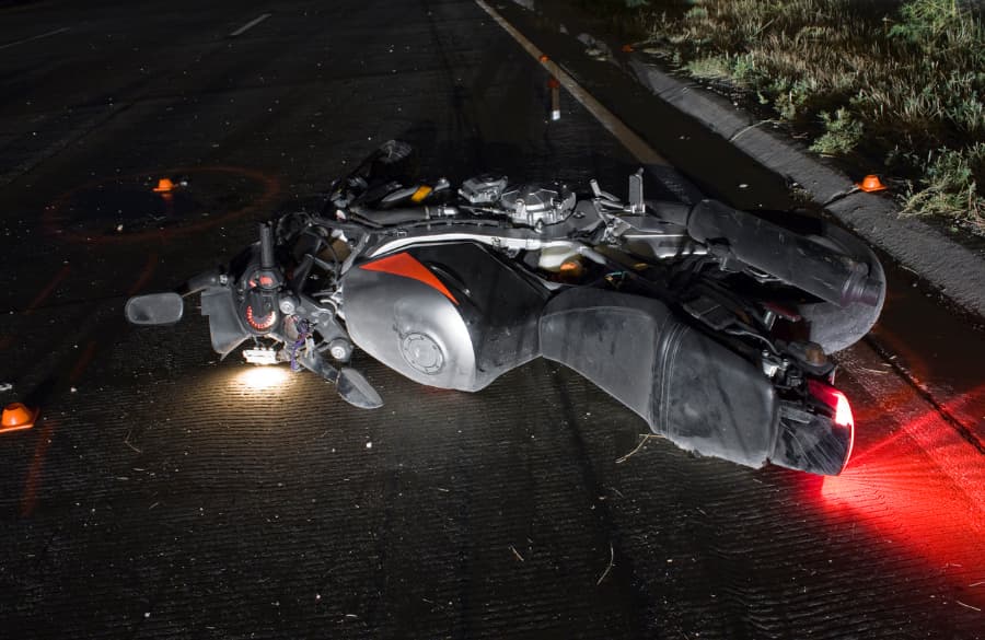 motorcycle on street at night after accident