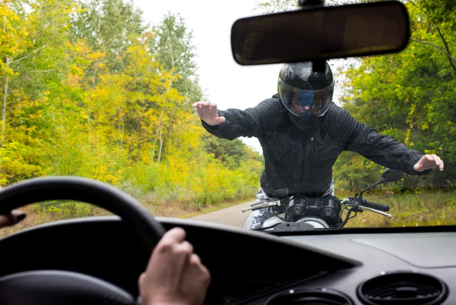 Motorcycle And Car In Head-On Collision