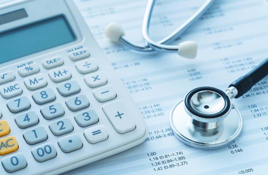 Medical Bills, Calculator, and Stethoscope