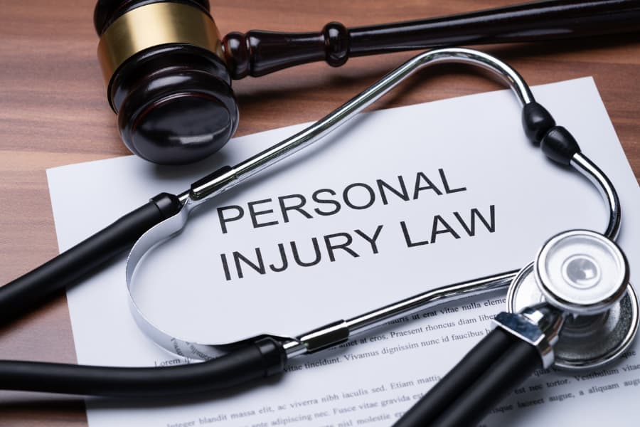Gavel And Stethoscope On Personal Injury Law Paper