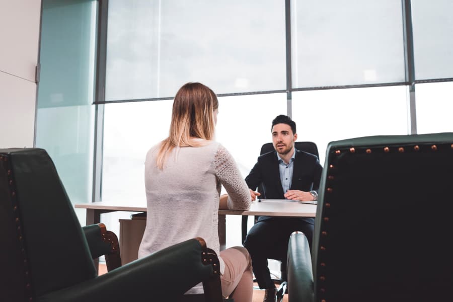 Woman speaking with a divorce attorney