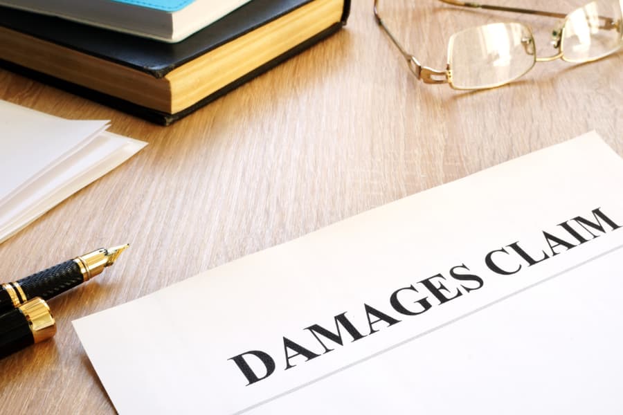 Personal Injury Damages Claim Form And Pen